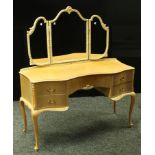 A 20th century mahogany dressing table. cabriole legs.