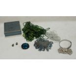 A metamorphic buckle/brooch/clips, set with stones; similar bangle and earrings; a blue glass