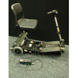 A Luggie mobility scooter with battery charger