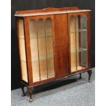 An early 20th century oak display cabinet