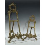 A brass cabinet display picture easel; another, similar