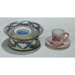 A French inkwell, painted with swags of roses, painted mark in blue, 12cm diameter; a Shelley