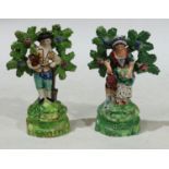 A pair of 19th century Staffordshire pearlware figures as gardeners, c.1825, 14cm high (restored)