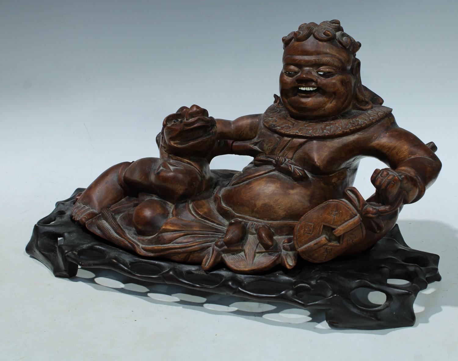 A Chinese hardwood figure, carved as Liu Hai and a three legged toad, carved and pierced base, - Image 2 of 2