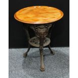 A Victorian cast iron and mahogany 'abolitionist' pub table, circular top, 70cm high.