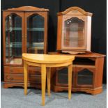 A Rossmore furniture display cabinet; another corner unit; corner display cabinet; demilune tea