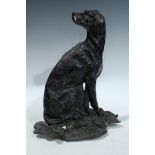 A 19th century English country house cast iron door stop cast as a seated hound, 33cm high,