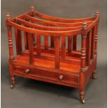 A George IV mahogany three-section Canterbury, bowed divisions, turned finials and supports,