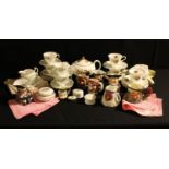 A Staffordshire floral printed part teaset; another with teapot; assorted character jugs; cotton and