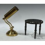 A brass desk lamp; a Bonzo the dog cast iron trivet