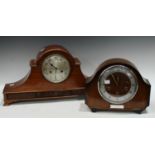 A flame mahogany mantel clock, arched case, silvered dial, Arabic numerals, twin winding holes,