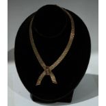 A 9ct gold blue sapphire inset textured brick link necklace, Birmingham 1970, 50g gross