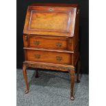 A mid 20th century mahogany bureau, narrow proportions, fall front inclosing pigeon holes and a