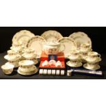 A Royal Crown Derby Posie pattern tea set for twelve, teapot, sugar bowls, cruet set, cake slice,
