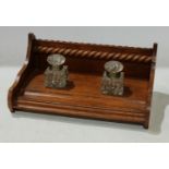 A late Victorian/Edwardian oak desk stand, wrythen glass inkwells, c.1900