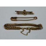 A 9ct gold bracelet; a 9ct bar brooch; a gold coloured safety pin (3)