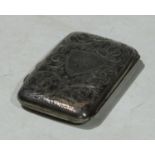 An Edwardian silver cigarette case engraved and chased with foliate scrolls, Birmingham 1907, 7.