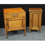 A mid 20th century mahogany bedside cabinet, rectangular top outlined throughout with ebony and