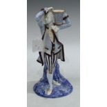 A Royal Worcester candlestick, figure of a dandy