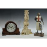 An oak mantel clock; a resin model of a crusaider, 38cm; a moulded rersin Indian style stand,