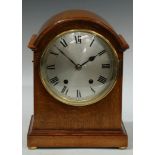 A George III style light oak mantel clock, arched case, silvered dial, Roman numerals, eight day