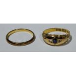 A 22ct gold wedding band, 2.4g; an 18ct gold ring, set with a sapphire and diamond chips, 2.7g (2)