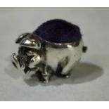 A silver novelty pin cushion, as a pig