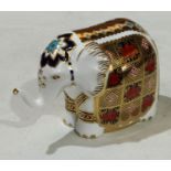 A Royal Crown Derby paperweight, Imari Elephant, raised trunk, gold stopper, 10.5cm high, printed