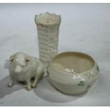 A Belleek porcelain model of a pig, printed mark to base, 8cm high; a Belleek sugar bowl, shamrock