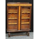 An oak lead glazed bookcase
