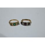 An 18ct gold and platinum diamond and ruby ring, 4.1g; an 18ct gold diamond and emerald ring, 3g (2)