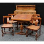 An oak dining suite, rectangular draw leaf table with urnular column supports, four curved splat
