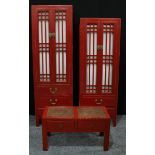 A pair of Chinese inspired red lacquered linen press; low coffee/tea table.(3)