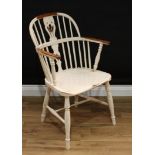 A painted yew Windsor chair, pierced and shaped splat, saddle seat, turned H stretcher.