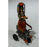 Tinplate - a clockwork tinplate duck cyclist