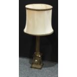 A composite cast Corinthian column lamp base, the capital cast with scrolls, fluted column, square