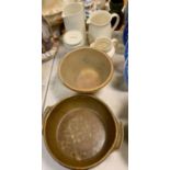 A salt glazed bowl, stoneware jugs, storage jar and casserole