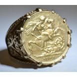An King Edward VII full sovereign mounted in a 9ct gold ring size W, 15.7g gross