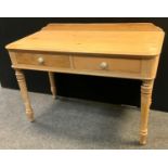 An early 20th century pine rounded rectangular side table, 114cm wide, 74cm high