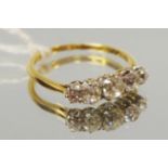 A yellow metal five stone ring claw set with graduated round diamonds approx 1.2cts total, size Q