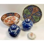 A pair of Chinese blue and white jars and covers, small Chinese famille rose circular powder bowl