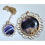 A Blue John disc panel pendant, 9ct gold frame, Birmingham 1979, 17.3g gross; another smaller with