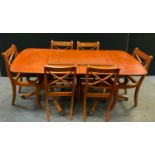 A modern yew veneered D-end extending dining table , two carvers and four chairs. (7)