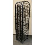 A contemporary wrought iron 36 bottle wine rack