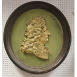 A 19th century portrait relief, of George II, in gilt on a green ground, integrated frame, 66cm diam