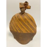 Eugene Ugbine (Nigerian) an African studion pottery sculptural figure, Tribeswoman, sign, dated