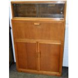 A Minty desk, slide bookcase top, fall front, fitted interior, above pair of paneled doors