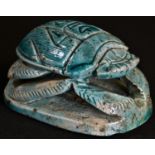 An Egyptian Grand Tour turquoise faience model, of a scarab beetle, 9cm long