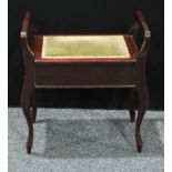 An Edwardian mahogany music room piano stool, hinged upholstered seat enclosing a vacant interior