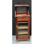 A Victorian mahogany music room cabinet, swan neck pediment, serpentine top above a rectangular